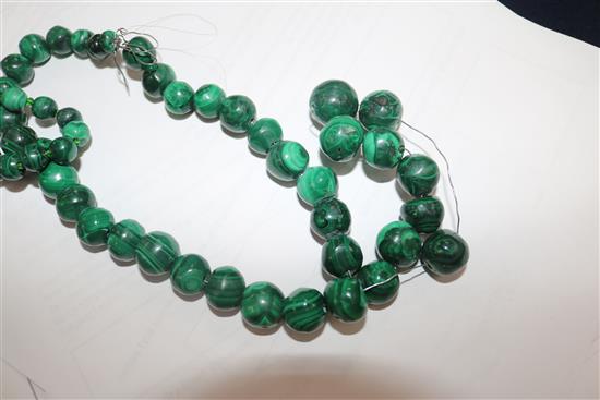 Three malachite bead necklaces and two amberoid bead necklaces